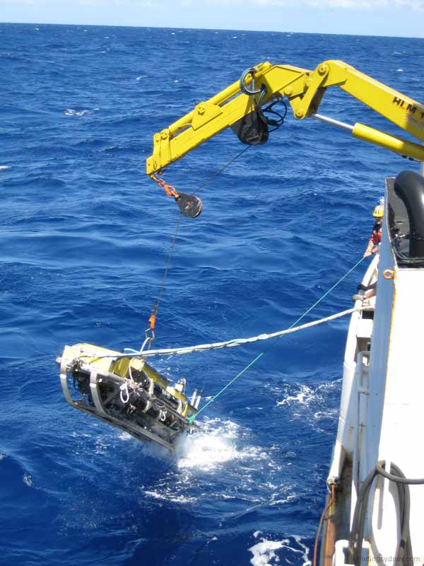 SM30 sonar towfish breaking the surface of the water.